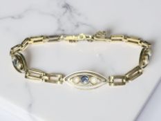 An antique 15ct gold sapphire and pearl bracelet CONDITION REPORT: 8.