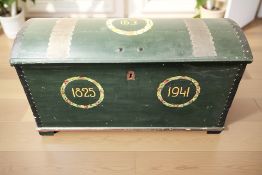 A Scandinavian painted pine domed blanket chest bearing the dates 1825 and 1941, width 124 cm.