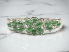 An 18ct white gold diamond and jade bracelet,