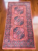 A machined rug of Afghan design, 170 cm x 90 cm.