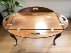A reproduction walnut butler's tray table, width 83 cm.