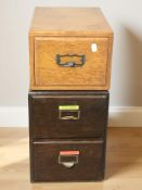 A 1920's golden oak filing drawer, width 26cm, together with a further similar two-drawer chest.