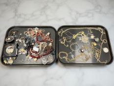 Two trays of costume jewellery, gold plated chains, beaded necklaces, Chokin plate, belt buckle etc.