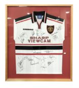 A framed and signed Manchester United football shirt, size M, 1997-1999 away shirt,