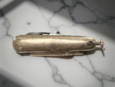 A gold-mounted penknife/multi-tool incorporating a pencil, length 5.