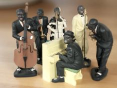 A group of jazz musician figures, tallest 56 cm.