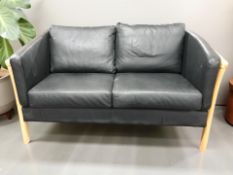 A contemporary Scandinavian wooden framed black leather two seater settee,