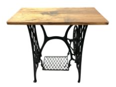 A Singer treadle sewing machine table, with later top, width 80 cm.