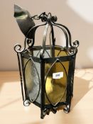 A wrought metal and glass hanging light shade, height 44 cm.
