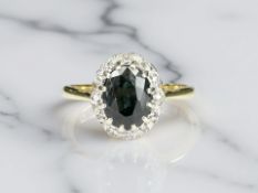 A sapphire and diamond cluster ring, stamped 18ct, size O CONDITION REPORT: 3.