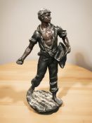 A patinated spelter figure of a man scattering seeds, after Rousseau,