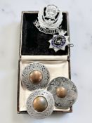Three Celtic pewter brooches, stamped St Justin,