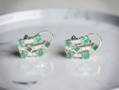 A pair of 18ct white gold emerald and diamond earrings CONDITION REPORT: 5.
