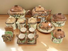 A group of cottage ware ceramics including egg cruet, toast rack, teapot, etc.