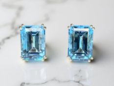 A pair of 9ct gold blue topaz earrings, the total carat weight estimated at 16.20 carats, 1.