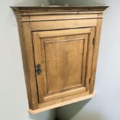 A 19th century oak hanging corner cabinet, height 96 cm.
