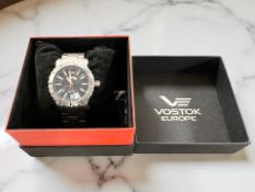 A gent's stainless steel automatic calendar centre seconds wristwatch, signed 'Vostok,