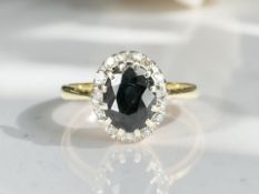 A sapphire and diamond cluster ring, stamped 18ct, size N½ CONDITION REPORT: 3.