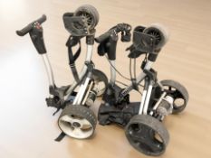 A Precision golf trolley and a Pro Master Plus trolley