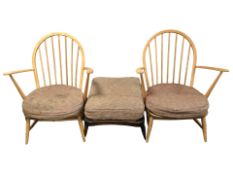 A pair of Ercol light elm model 305 spindle low-back lounge armchairs, together with a footstool.
