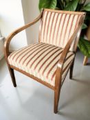 A continental oak armchair in studded classical fabric,