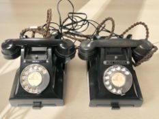 Two black Bakelite telephones.