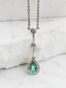 A fine 18ct white gold emerald and diamond pendant,