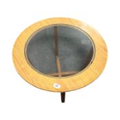 A 20th century teak glass inset circular coffee table, diameter 61 cm.