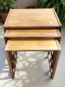 A G Plan nest of three teak tables, width 54 cm.