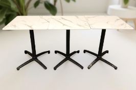 Three folding cafe tables,