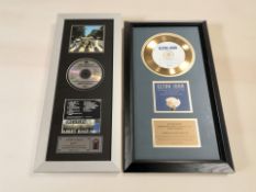An Elton John gold disc 