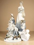 A group of Spanish porcelain figures, treen bowls and vases,