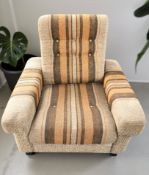 A Scandinavian 1970's lounge armchair in striped fabric,