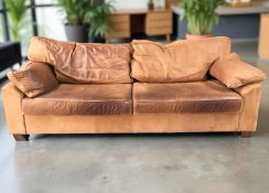 A Scandinavian tan leather four seater settee,