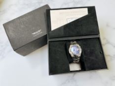 A Gent's stainless steel Navigator wristwatch, in fitted retail box with charging stand and adaptor.