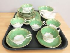 Twenty pieces of T Goode & Co. green and gilt porcelain tea china.