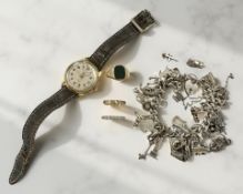 A group of jewellery items to include a silver charm bracelet,