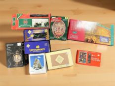 A group of boxed christmas lights and similar decorations.