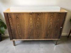 A Danish rosewood effect sliding door sideboard / cabinet, 120 cm x 46 cm x 95 cm.