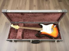 A Starsound electric guitar, in a hard shell guitar case.