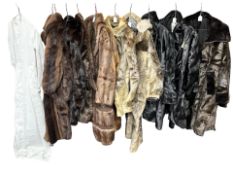 A collection of vintage fur coats and jackets, and a vintage night gown.