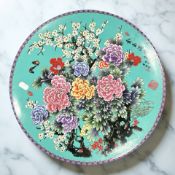 A contemporary Chinese porcelain charger on turquoise ground,