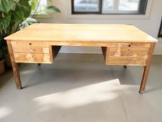 A Scandinavian oak twin-pedestal partner's desk,