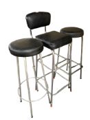 A pair of metal bar stools and a further bar chair