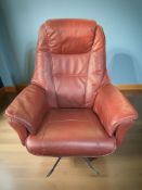 A Scandinavian red stitched leather armchair on chrome legs