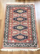 A machine made Iranian design rug, 157 cm x 100 cm.