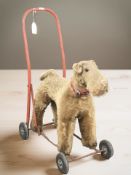A 1950's fox terrier push along dog toy,