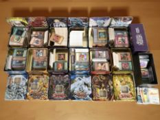 A large quantity of Pokemon and Yu-Gi-Oh! cards in tins.
