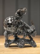 A contemporary Chinese carved hardwood figure of a man, astride a water buffalo,