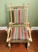 A blonde oak bobbin turned rocking chair, width 63 cm.